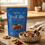 YouGrow Trail Mix packaging on a wooden table with a bowl of trail mix and ingredients.