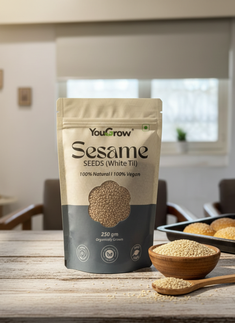 YouGrow Sesame Seeds package on a wooden table with a bowl of seeds and a spoon.