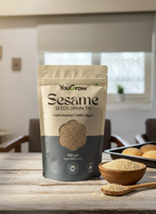 YouGrow Sesame Seeds package on a wooden table with a bowl of seeds and a spoon.