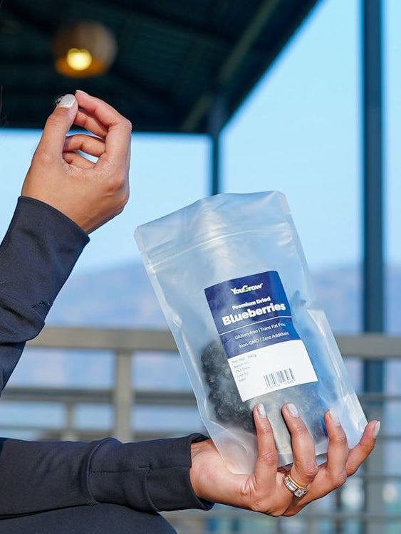 Woman holding a package with a scenic background